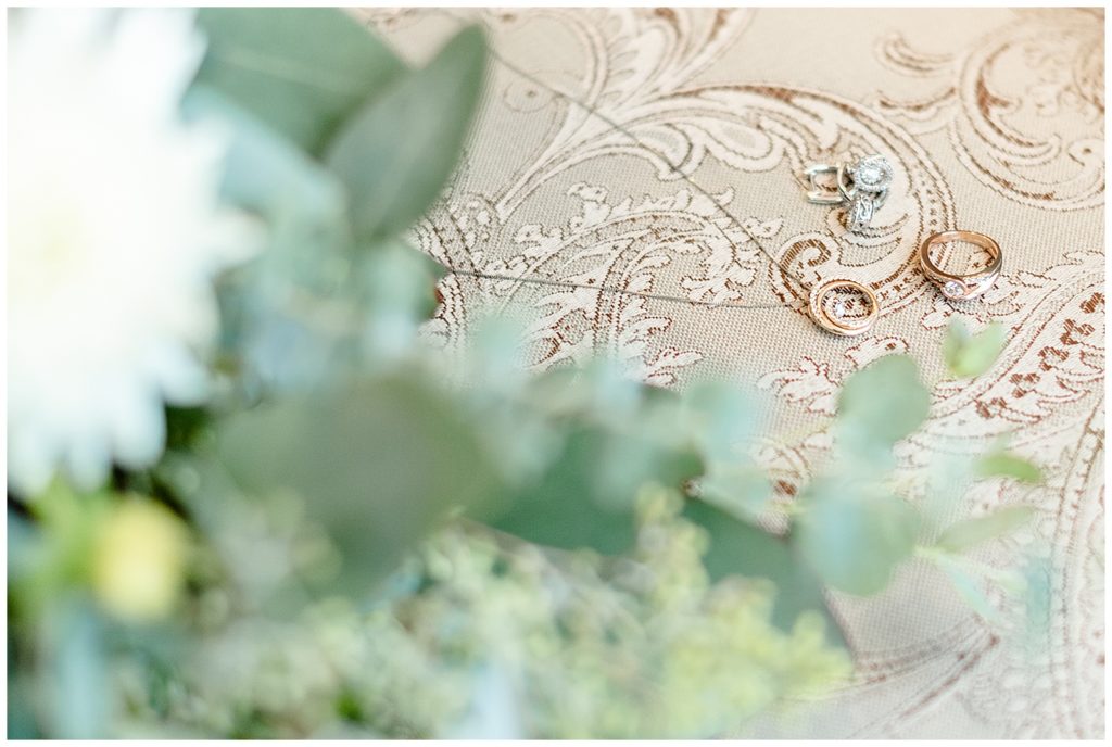 The Best Boise Wedding Photographers, Denise and Bryan Photography. Detail shots of rings and bouquet on a chair
