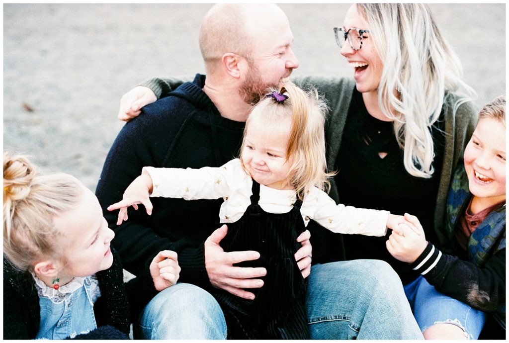 Spokane Family Film Photographer. Family photos on the beach at lake Coeur d'alene 